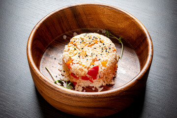 rice with vegetables in the wooden bowl