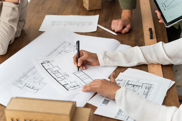Close-up of colleagues working in architectural office