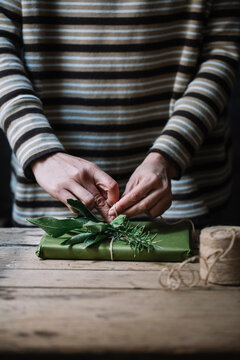 Woman's hands wrapping present