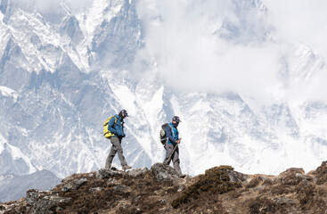 Nepal, Solo Khumbu, Everest, Mountaineer and sherpa walking in the mountains