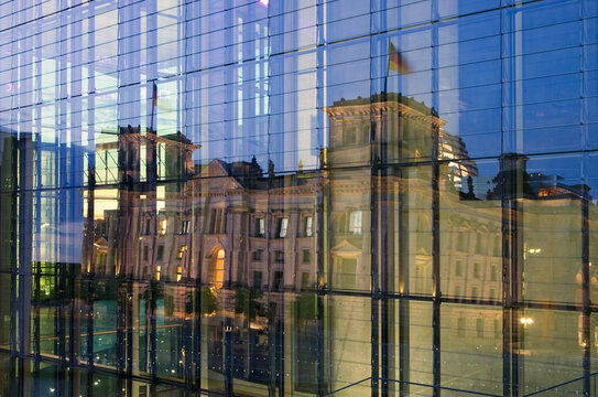 Germany, Berlin, Berlin-Mitte, reflection of the Reichstag building in a glass faceade