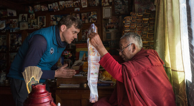 Nepal, Sherpa getting a blessing from moch, before climbing he Mount Everest