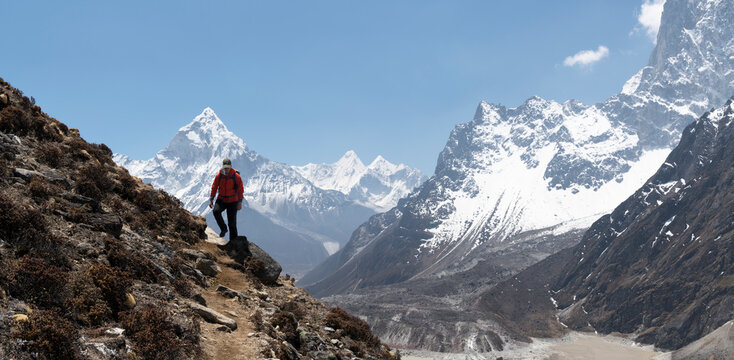 Young woman hiking in Sagarmatha National Park, Everest Base Camp trek, Nepal