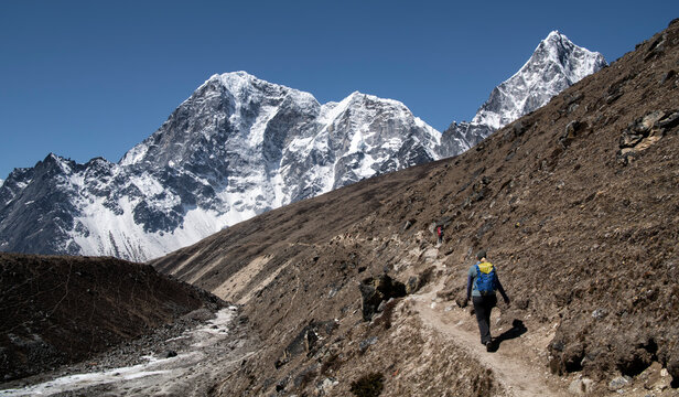 Young woman hiking in Sagarmatha National Park, Everest Base Camp trek, Nepal