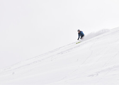 Georgia, Caucasus, Gudauri, man on a ski tour riding downhill
