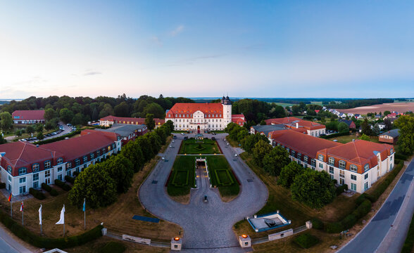 Germany, Mecklenburg-Western Pomerania, Mecklenburg Lake District, Goehren-Lebbin, Aerial view of Castle Hotel Fleesensee in the evening