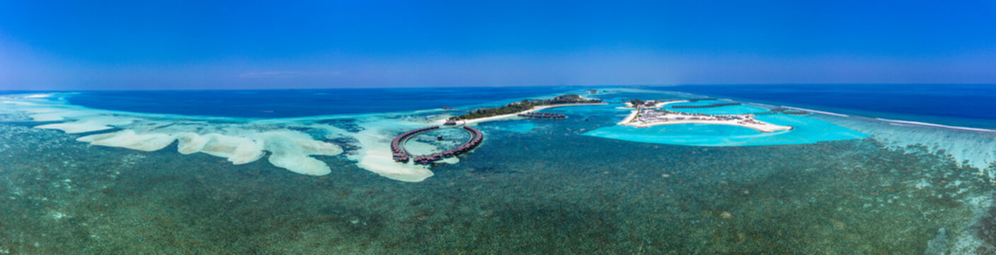 Aerial view over Olhuveli with water bungalow, South Male Atoll, Maldives
