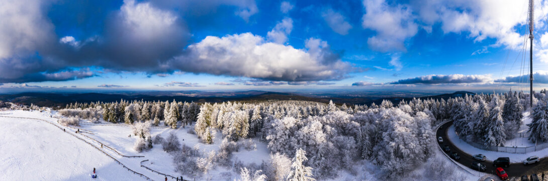 Germany, Hesse, Taunus, Aerial view of road through coniferous forest in winter