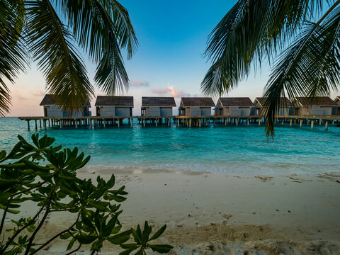 Maledives, Ross Atoll, water bungalows at the beach in the evening