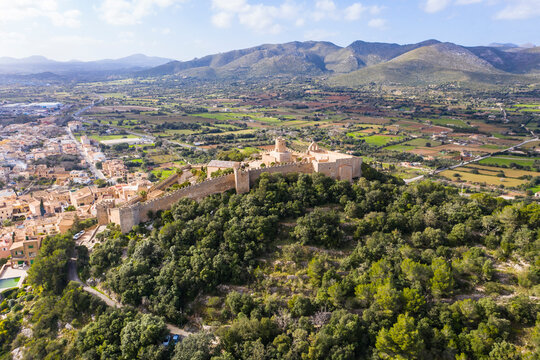 Aerial view of Castle Of Capdepera by trees against sky