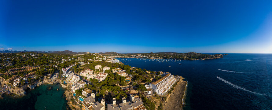 Spain, Balearic Islands, Costa de la Calma, Aerial panorama of clear blue sky over coastal town in summer
