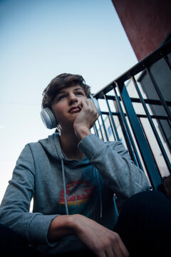 Portrait of teenager with headphones, thoughtful