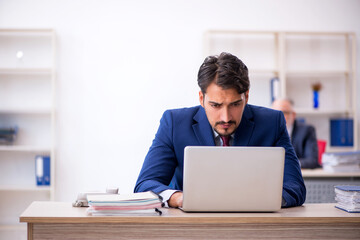 Two male colleagues working in the office