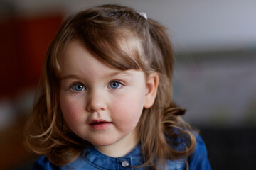 Portrait of toddler girl with blue eyes