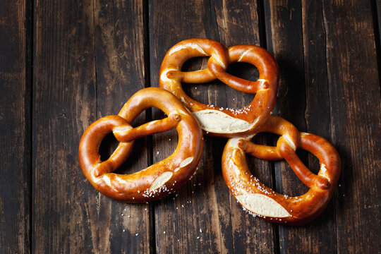 Three pretzels on wood