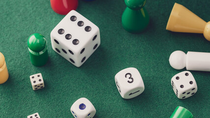 Colored board game figures with dice. Board games concept