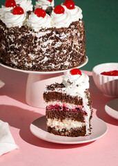 Schwarzwalder Kirschtorte, black forest cake, harsh light, table background in sunlight, modern still life, cherry dessert on modern background