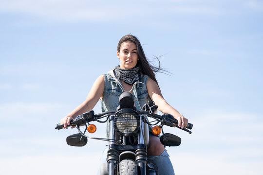 Young Beautiful Woman Riding Motorbike