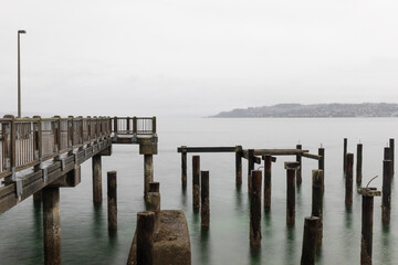 Fototapeta na wymiar Foggy Day at the Pier Along the Coast (Commencement Bay, Tacoma, WA)