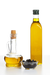 Extra virgin olive oil in a glass bottles isolated on white background.