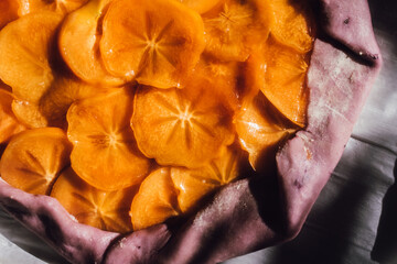 persimmon and mascarpone galette with purple crust dough