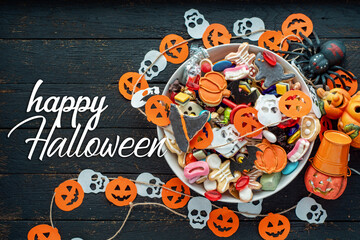 candy bowl of cookies, candy, chocolates and sweets, Halloween Jack o Lantern - Trick or Treat Halloween card dark background