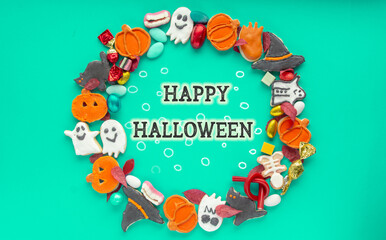 round frame wreath of sweets for the holiday halloween, Trick or Treat candy pumpkin, ghost, skeleton cookies	
