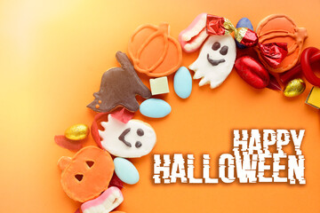 round frame wreath of sweets for the holiday Halloween, Trick or Treat candy pumpkin, ghost, skeleton cookies	
