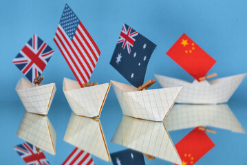 ships with flags of Australia, United States and United Kingdom as new military alliance security...