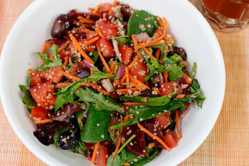 Healthy Salad of Mixed Vegetables, Fruit and Seeds in a Bowl