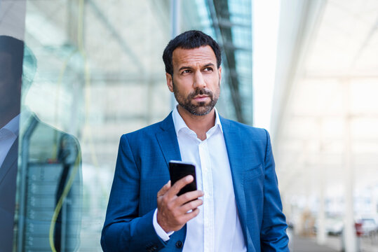 Businessman holding smartphone