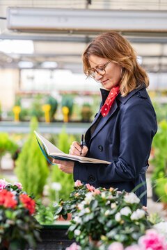 Female manager working in a plant nursery