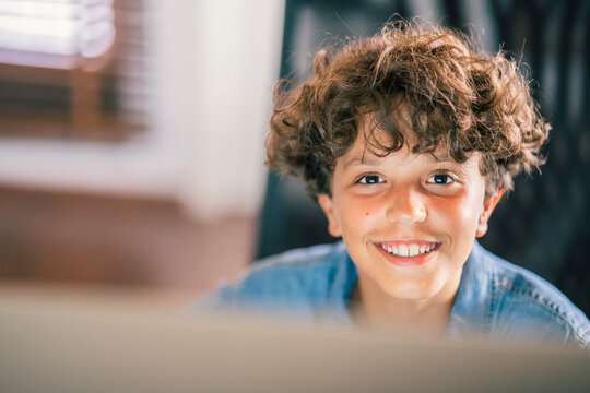 Portrait of smiling boy at home