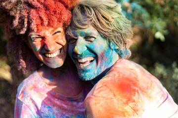 Happy couple celebrating Holi festival. Festival of colors