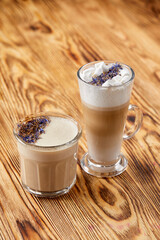 the art of coffee with milk foam on wooden table
