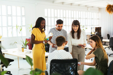 Colleagues discussing in office