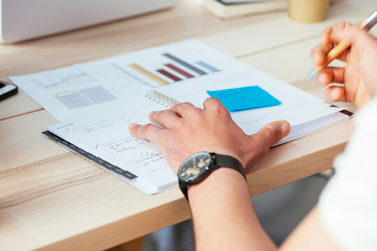Man working on documents at desk in office