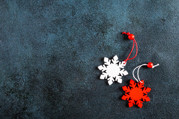 Christmas background. Red and white decorations on dark background. Top view with copy space. New Year flatly. Christmas flatly with decorations
