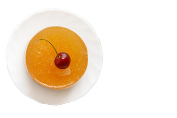 A cheesecake decorated with cherries lies on a saucer on a white background. Sweet dessert.