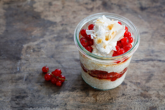 Jar of gluten free amaranth mousse with red currant berries