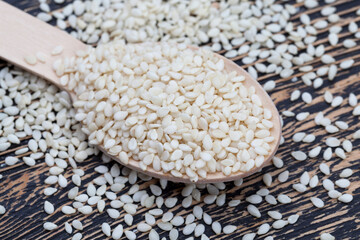 white sesame seeds on a wooden table