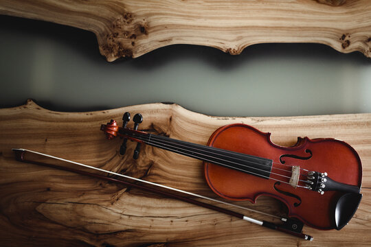 Violin and bow on wood