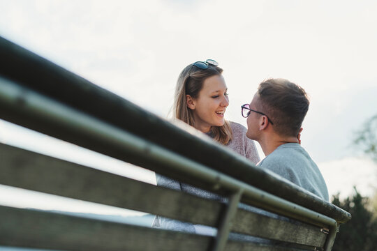 Happy young couple in love at backlight
