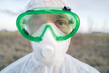 Portrait of man wearing protective suit and goggles