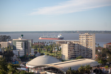 Aerial view of the city of Maputo, with ship sailing in the bay of Maputo close to tall buildings