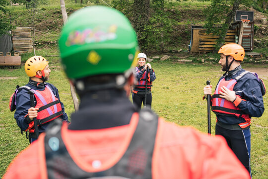Instructor with group of friends at a rafting class