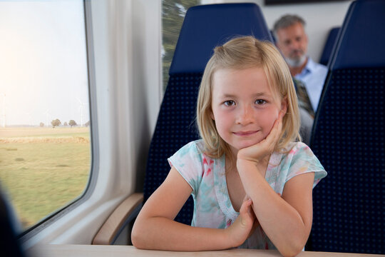 Little girl traveling by train