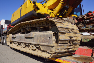 Oversize Load or exceptional convoy (convoi exceptionnel). A truck with a special semi-trailer for transporting oversized loads. Transport of a huge bulldozer.