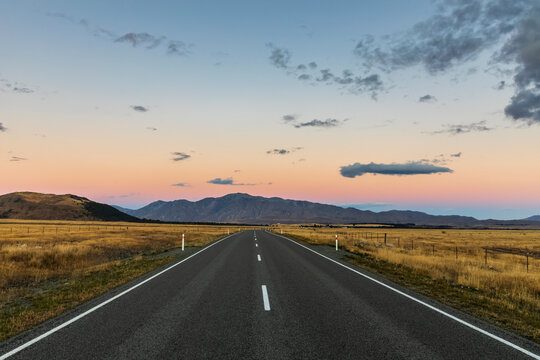 New Zealand, Oceania, South Island, Canterbury, Road towards Lake Tekapo at sunset