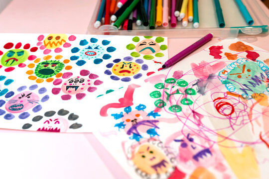 Children's drawings of ugly viruses made with watercolors and color markers